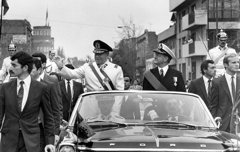 Augusto Pinochet waves from a  motorcade on September 11th, 1973 in Santiago, shortly after he came to power in Chile.  The coup reverberated around the world, marking the start of one of the most brutal of a series of US-friendly, right-wing dictatorships that governed much of South America well into the 1980s. Photograph: AFP/Getty Images