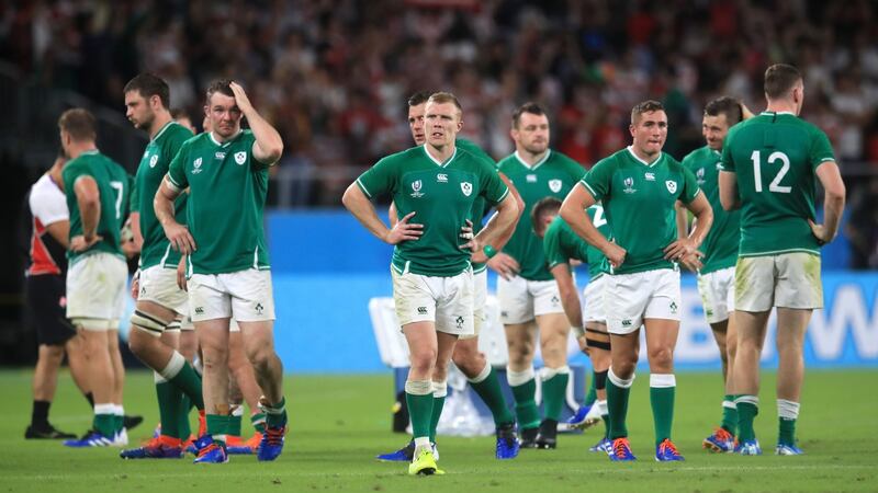 Ireland players stand dejected after the defeat. Photo: Adam Davy/PA Wire