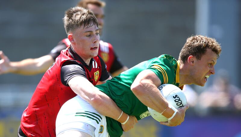 Down’s Ceilum Doherty tackles Ronan Jones of Meath during the Tailteann group clash at Parnell Park. Photograph: Leah Scholes/Inpho 