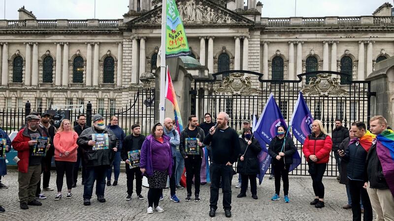People attend a vigil outside Belfast city hall in memory of Aidan Moffitt and Michael Snee. Photograph: David Young/PA Wire