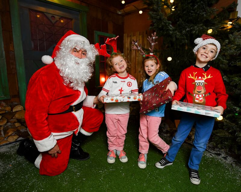 Lauren O'Brien, Katie May O'Brien and Alexander Bellintani with Santa during a Santa Experience at Croke Park in Dublin in 2019. Photograph: Seb Daly/Sportsfile