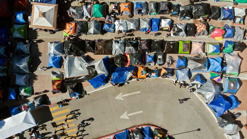 Migrants camp where asylum seekers wait for US authorities to allow them to start their migration process outside El Chaparral crossing port in Tijuana, Baja California state, Mexico. Photograph:  Guillermo Arias