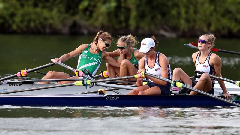 Ireland’s Claire Lambe and Sinéad Lynch congratulate each other after finishing third in yesterday’s women’s double sculls semi-final, thereby qualifying for the Olympic final. Photograph: Martin Rickett/PA Wire.
