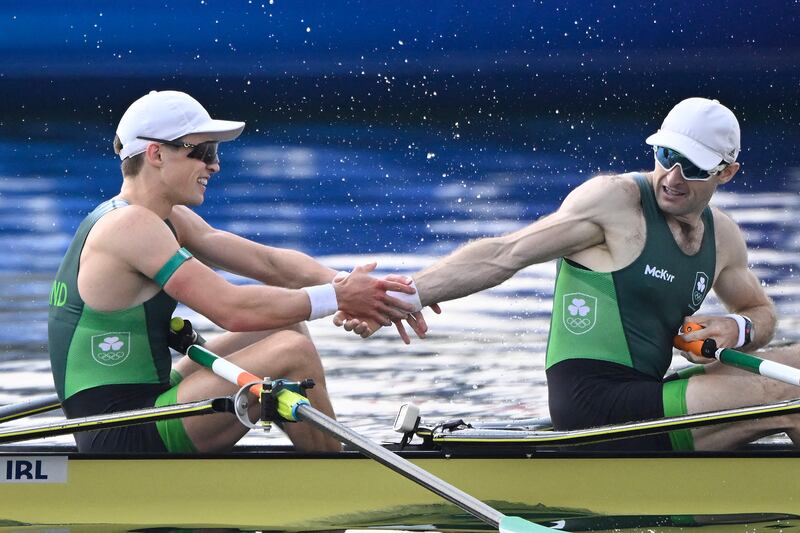 Ireland's Fintan Mc Carthy (left) and Paul O Donovan celebrate winning the Olympic gold medal at Vaires-sur-Marne Nautical Centre. Photograph: Olivier Morin/AFP via Getty Images)
