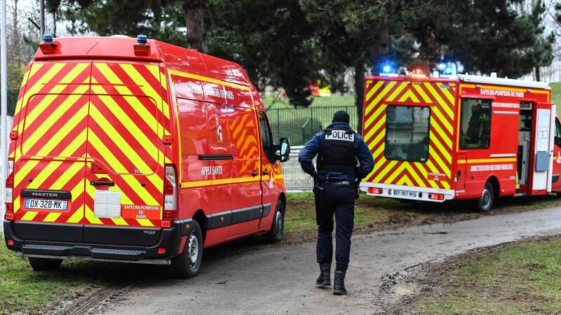 Emergency vehicles in a park in the south of Paris’ suburban city of Villejuif where a man was shot and killed by officers after stabbing passersby. Photograph: Getty