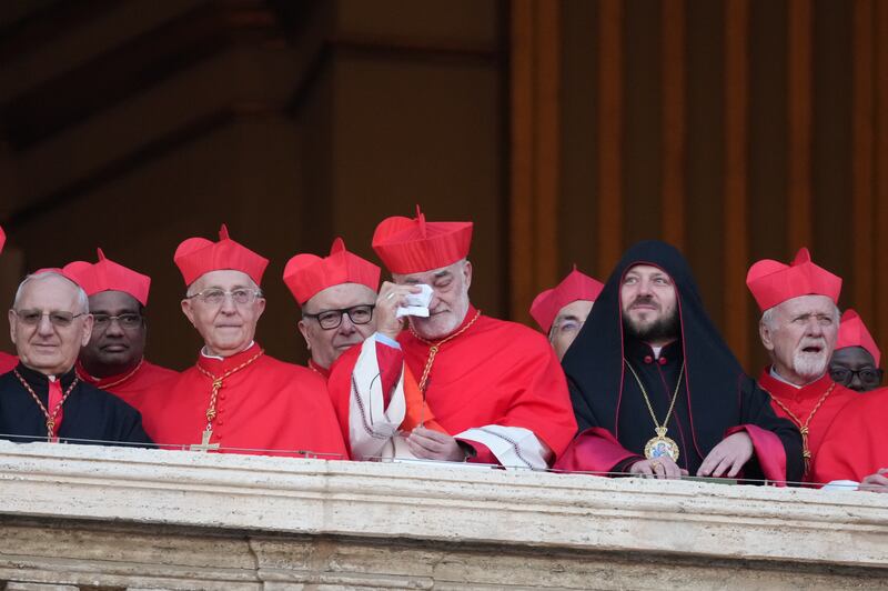 Cardinals gather as the newly elected pontiff, Pope Leo XIV is seen for the first time from the Vatican balcony. Photograph: Christopher Furlong/Getty Images