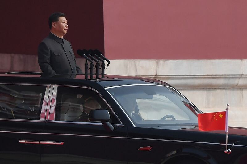 Chinese president Xi Jinping emerges from Tiananmen Gate before reviewing troops. Photograph: Greg Baker/AFP