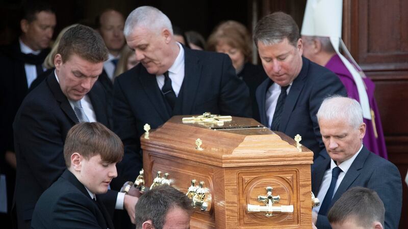 Gay Byrne’s remains are carried from St Mary’s Pro-Cathedral in Dublin following his funeral service. Photograph:  Colin Keegan, Collins Dublin