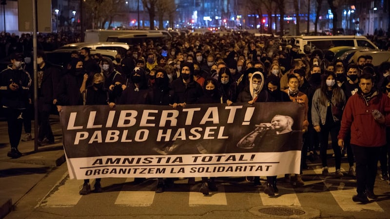 Protesters hold a banner reading ‘Free Pablo Hasél. Total Amnesty. Let’s organize solidarity’ in Barcelona on Wednesday. Photograph: Ramon Gabriel/EPA