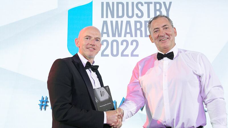 Kevin Hoban, Director, H2 Compliance, presents the Pharma Supplier of the Year award to Aidan O'Mahony, Hanley Calibration.