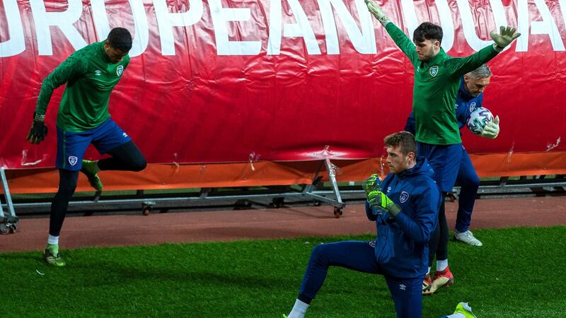 Goalkeepers Gavin Bazunu, Mark Travers and Kieran O’Hara warm up at the Stadion Rajko Mitic ahead of an Ireland training session. Photograph: Nikola Krstic/Inpho