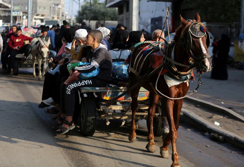 Palestinians fleeing their homes in Khan Younis. Photograph: Yousef Masoud/The New York Times 