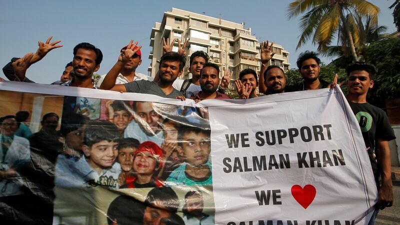 Fans of Bollywood actor Salman Khan hold a banner outside his house after a court in Jodhpur granted him bail. Photograph: Francis Mascarenhas/Reuters.