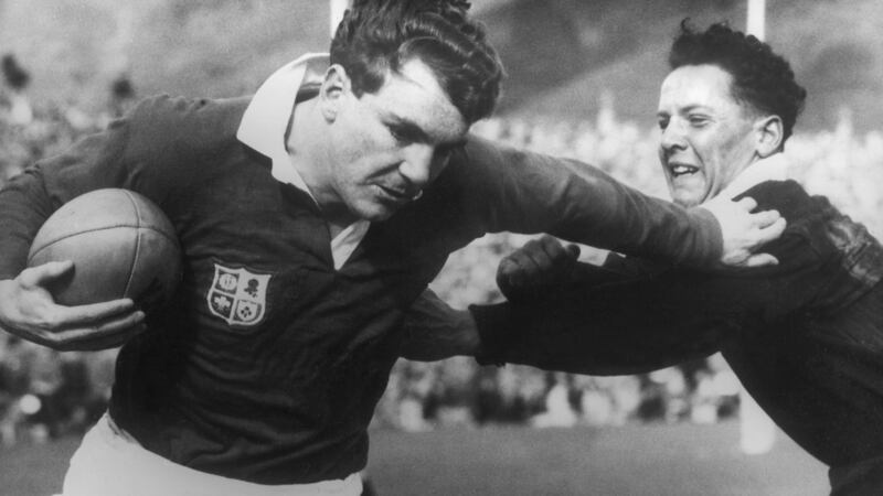 Irish winger Tony O’Reilly of the Lions fends off DJ Davison of the Junior All Blacks during a game on the 1959 tour in  Wellington. (Photograph:  Central Press/Getty Images)