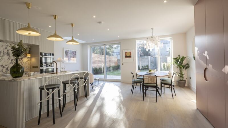 Kitchen and dining area in four-bed homes.