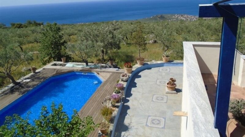 Greek house with olive trees