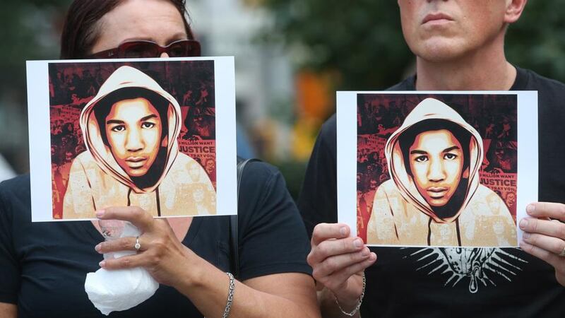 Protesters hold photos of Trayvon Martin at a rally at Union Square in Manhattan, New York City, yesterday. Photograph: Mario Tama/Getty Images