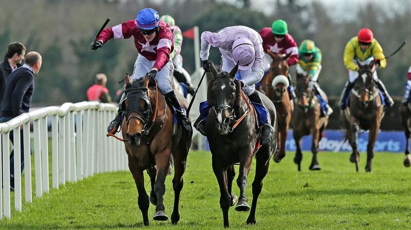 Ger Fox on Rogue Angel wins the Boylesports Irish Grand National just ahead of Ruby Walsh on Bless the Wings. Photo: Morgan Treacy/Inpho