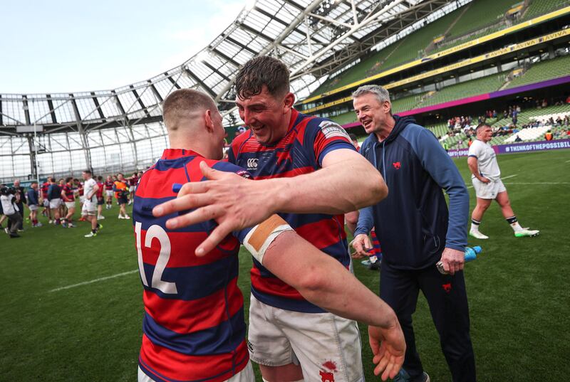 Clontarf's Connor Fahy and Fionn Gilbert celebrate after beating Cork Constitution on Sunday. Photograph: Bryan Keane/Inpho