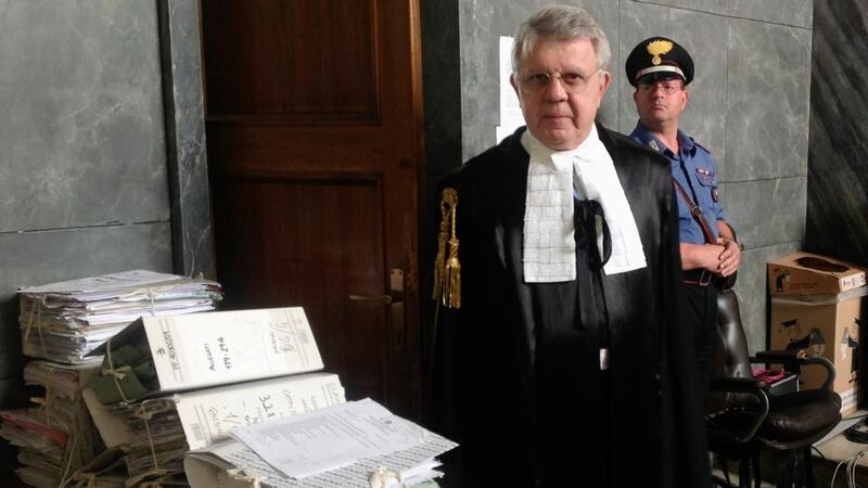 Italy’s former prime minister Silvio Berlusconi’s defence lawyer, Longo, poses at court. Photograph: Alessandro Garofalo/Reuters