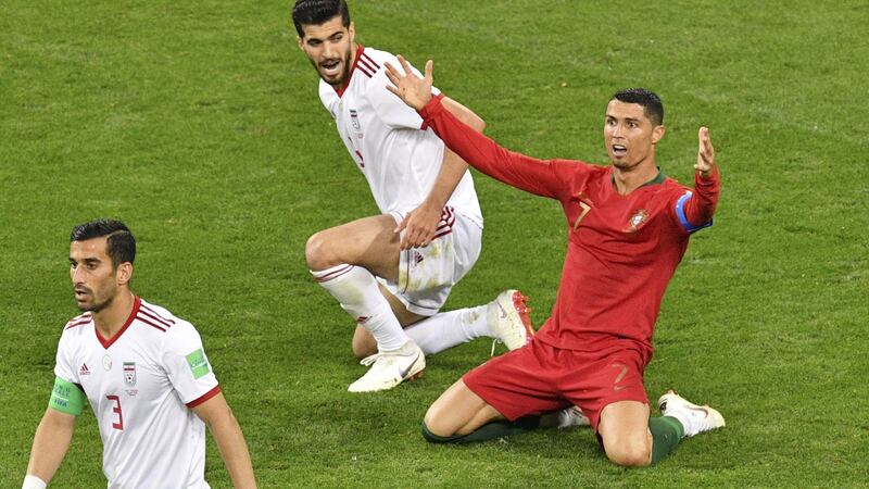 Iran v Portugal: Portugal captain Cristiano Ronaldo calls for a penalty. Photograph: Mladen Antonov/AFP/Getty Images