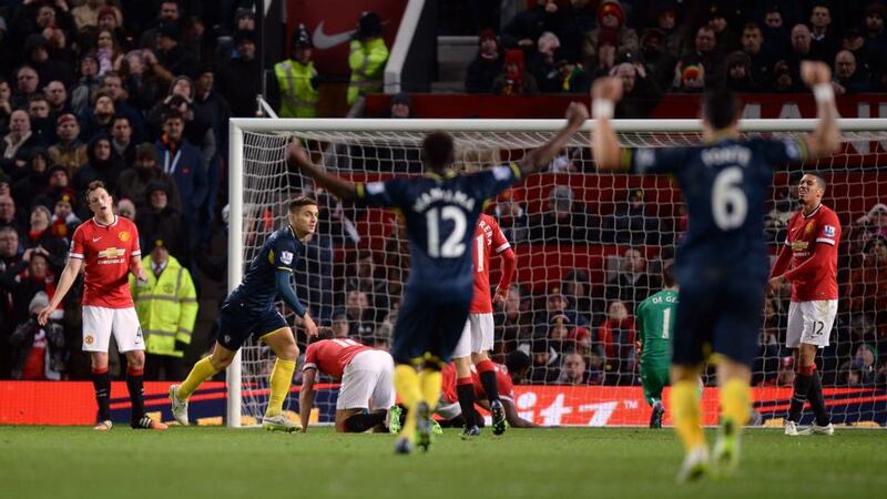 Southampton’s Dusan Tadic (second left) after   scoring against Manchester United  at Old Trafford. Photograph: Martin Rickett/PA Wire