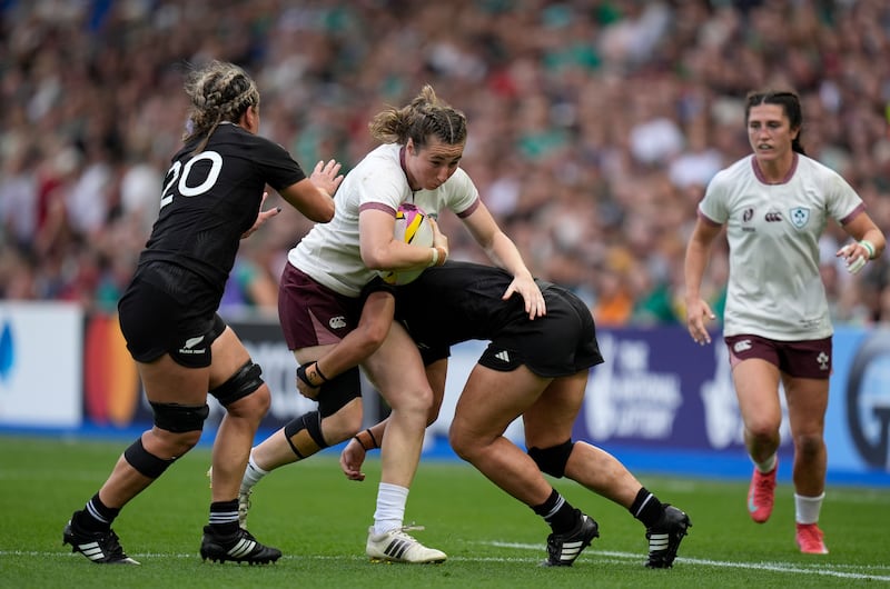 Ireland's Eve Higgins is tackled by New Zealand's Kennedy Tukuafu (left) and Ruahei Demant (right). Photograph: Andrew Matthews/PA