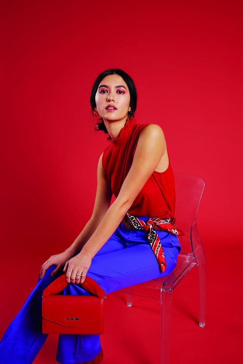 Sartorial satin: Top, €95, Claudie Pierlot; trousers, €195, Essential Antwerp; scarf (worn as belt), €115, Sandro; bag, €112, Love Moschino; earrings, €75, Dryberg Kern