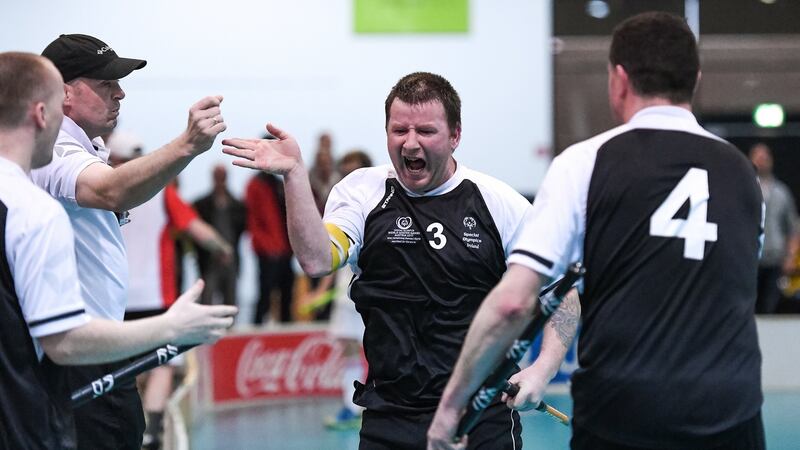 George Fitzgerald, (3), a member of Waterford Special Olympics Club, from John’s Hill, is congratulated  after he scoring a goal during the Floorball play-off game with Switzerland in Graz. Photograph: Ray McManus/Sportsfile