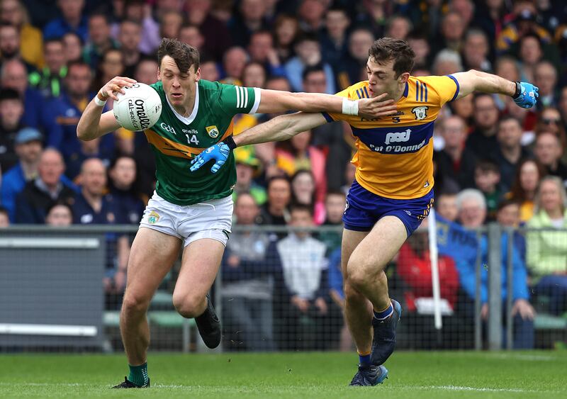 Kerry's David Clifford and Cillian Brennan of Clare during the Munster final in Limerick. Photograph: Bryan Keane/Inpho 