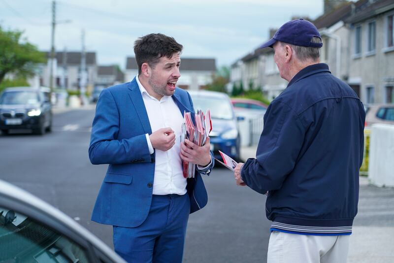 Labour Party candidate Conor Sheehan talking to constituent. Photograph: Enda O'Dowd