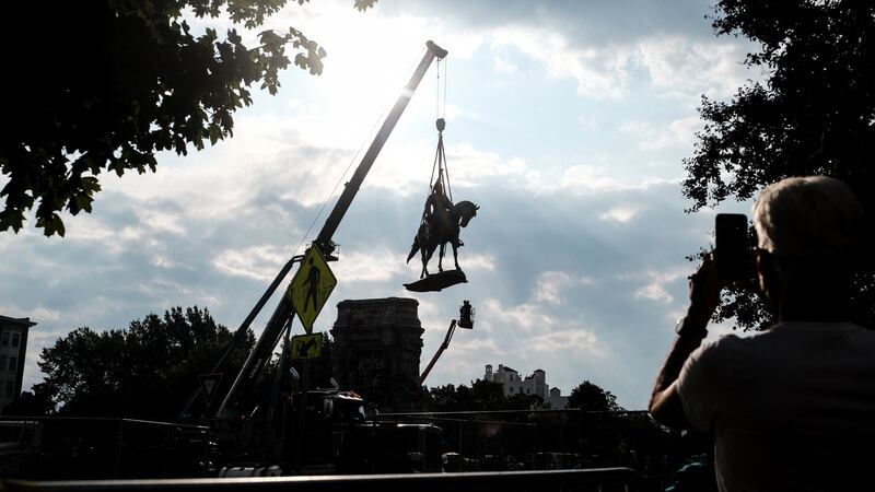 The statue of Robert E Lee being  removed from its pedestal in Richmond, Virginia. Photograph: Michael A McCoy/New York Times