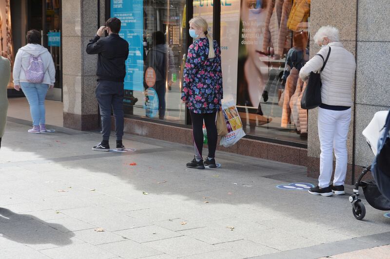People in a socially distant queue wait to enter Penneys on Dublin's O'Connell Street in September 2020 during the Covid-19 pandemic. Photograph: Alan Betson

