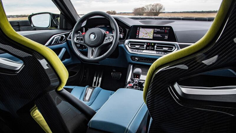 The cabin is as per the standard 4 Series  but with a tinseling of shiny carbon-fibre and red-blue-purple M-Sport contrast stitching everywhere