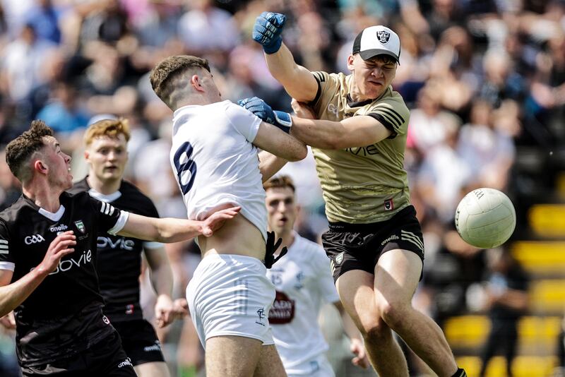 Sligo goalkeeper Ethan Carden and Seán Hanafin of Kildare in action during the final. Photograph: Laszlo Geczo/Inpho 
