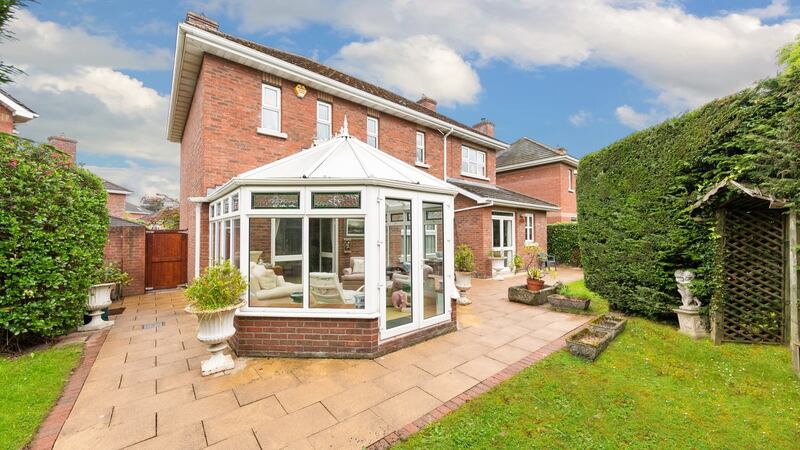 Doors lead out to the conservatory and a set of fold-back doors open into the formal dining room.