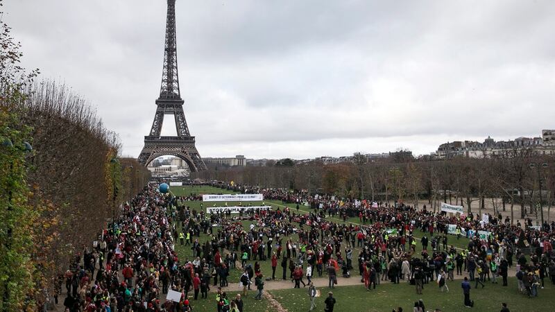Thousands rally in favour of genuine climate protection in front of the Eiffel Tower,  Paris, France,  December 12th, 2015. Photograph: Etienne Laurent/EPA