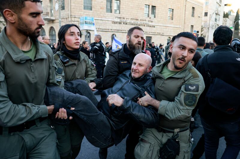 Israeli security forces carry away a protester during a demonstration on Wednesday against prime minister Binyamin Netanyahu and calling for an end to the war in Gaza. Photograph: Menahem Kahana/AFP via Getty Images    