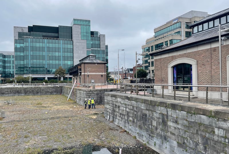 Emergency personnel at George's Dock Bridge in Dublin city after a fire broke out there on Tuesday of last week. Photograph: Grainne Ní Aodha/PA Wire

