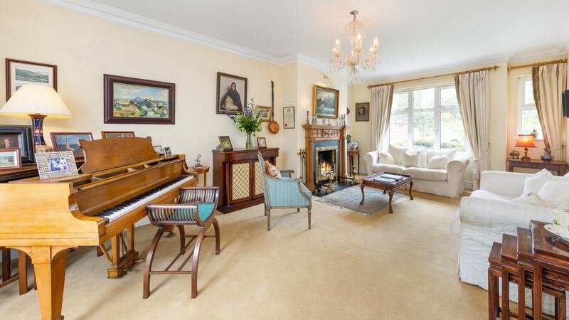 The house opens into a large L-shaped hall and flows around it with the drawing room to the right, a dual aspect space big enough to accommodate a baby grand piano.