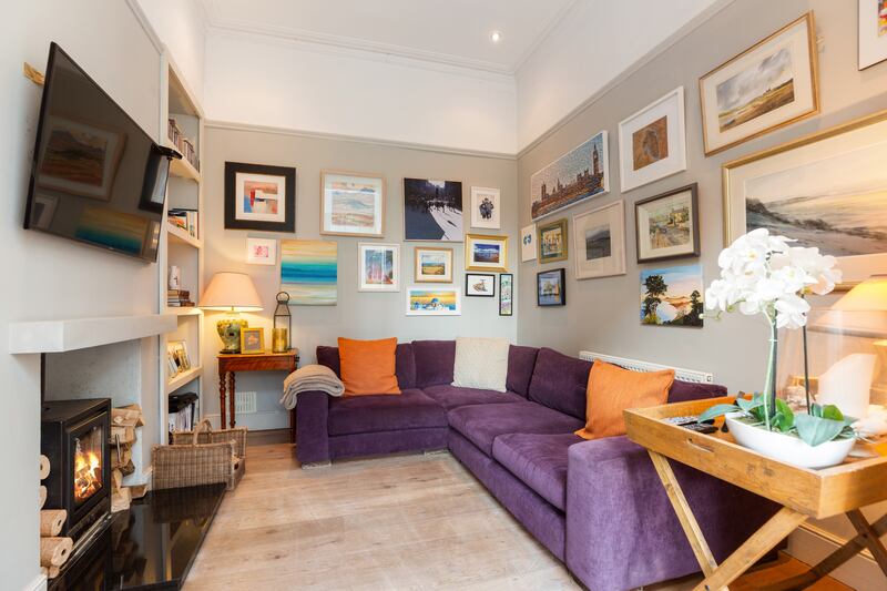 Beside the kitchen is a cosy snug for watching TV.