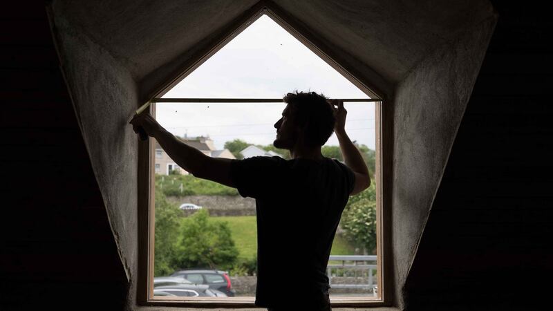 Harrison Gardner at work on an old house in Ennistymon, Co Clare. Photograph: Eamon Ward