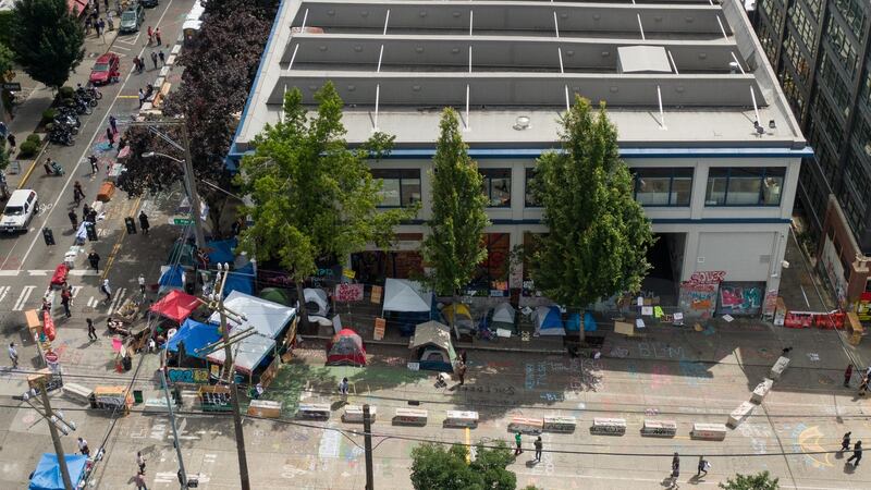 Barriers and tents are seen outside of the Seattle police department’s vacated precinct in the area known as the Capitol Hill Organized Protest  in Seattle, Washington. Photograph: David Ryder/Getty Images