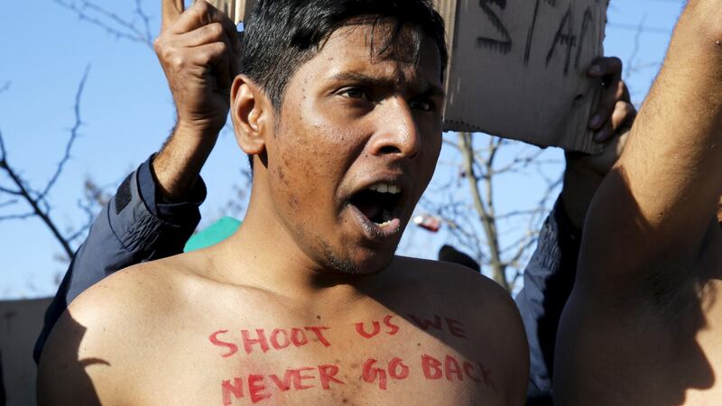 A   Bangladeshi migrant   protests at the border between Greece and Macedonia: The men had written slogans on their chests in red paint. “Shoot us, we never go back,” read one. “Shoot us or save us,” read another. Photograph:  Yannis Behrakis/Reuters