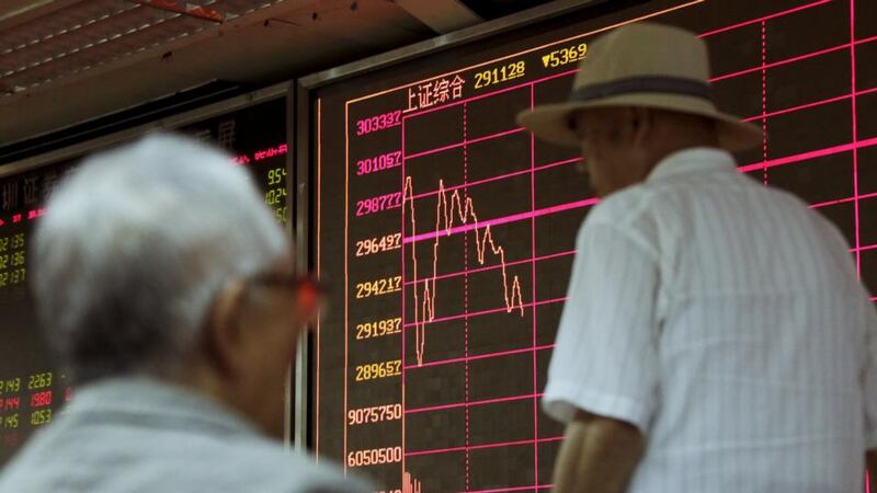 An investor pasts a board showing the Shanghai Stock Exchange Composite Index at a brokerage house in Beijing on Wednesday. Photograph: Jason Lee/Reuters