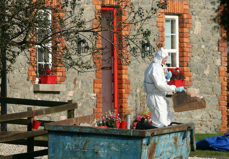 A member of the Garda Technical Bureau at the O'Connor family home near Tallanstown, Co Louth. Photograph: Colin Keegan/Collins, Dublin