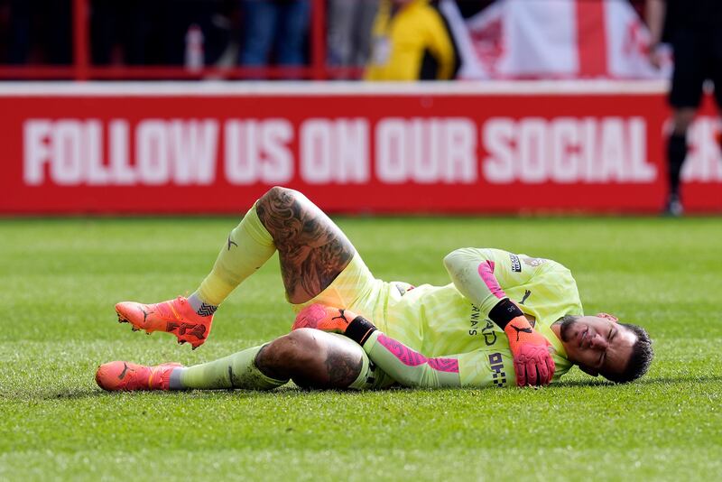 Ederson of Manchester City goes down injured against Nottingham Forest. Photograph: Tim Keeton/EPA 