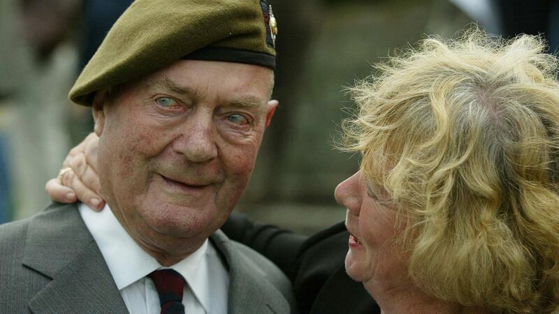 Former Irish Guardsman Jack Johnstone who took part in the Normandy landings 60 years ago is comforted by his niece Sylvia Tennant as he salutes fallen comrades at an emotional D-Day service held at Irish National War Memorial, in Dublin. Photograph: Gareth Fuller /PA Images via Getty Images