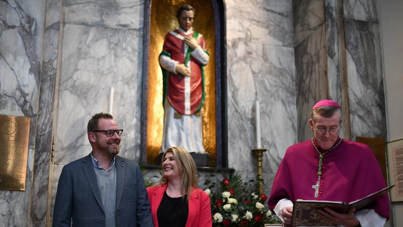 Bishop Denis Nulty blesses  engaged couple Emer Duffy from Rathfarnham, Dublin and Killian Casey from Ballyboden, Rathfarnham at the shrine of St Valentine in the Church of Our Lady of Mount Carmel, Whitefriar Street, Dublin. Photograph: Clodagh Kilcoyne/Reuters
