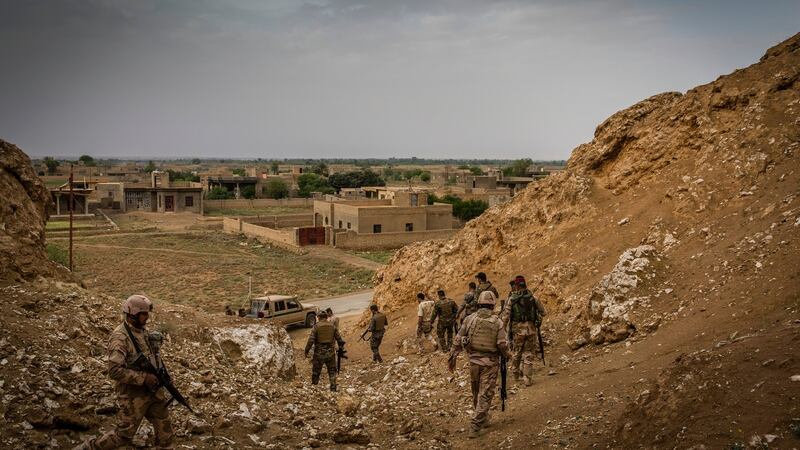 Iraqi border guard troops patrol the Syrian border near Qaim this year. Captain Sudani may have spent his final days there. Photograph: Ivor Prickett/The New York Times